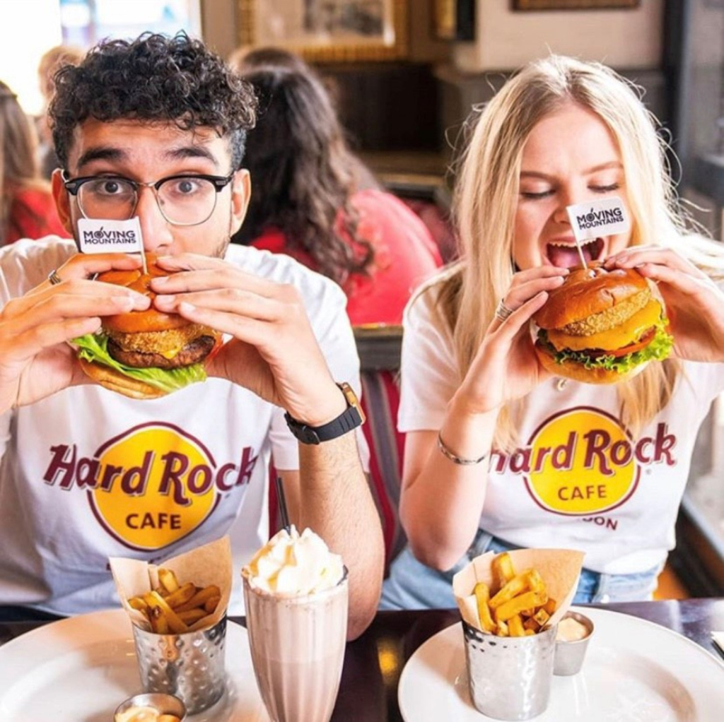 People eating hamburgers at Hard Rock Cafe Tenerife.