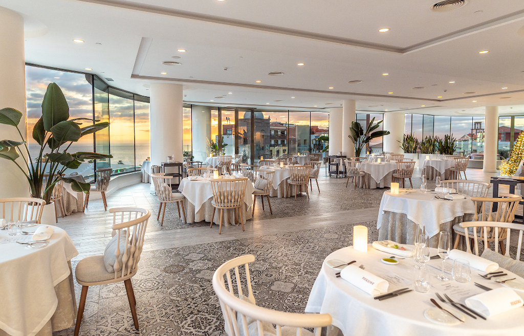 Elegant restaurant with sea view at sunset in Tenerife.