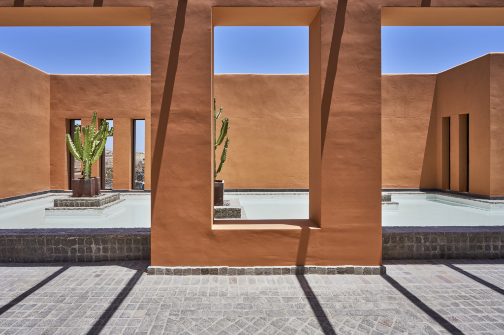 Patio with cacti and swimming pools in modern architecture in Tenerife.