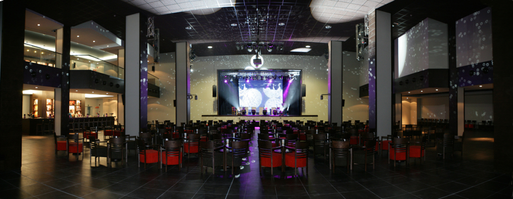Performance hall with illuminated stage and empty seats in Tenerife.