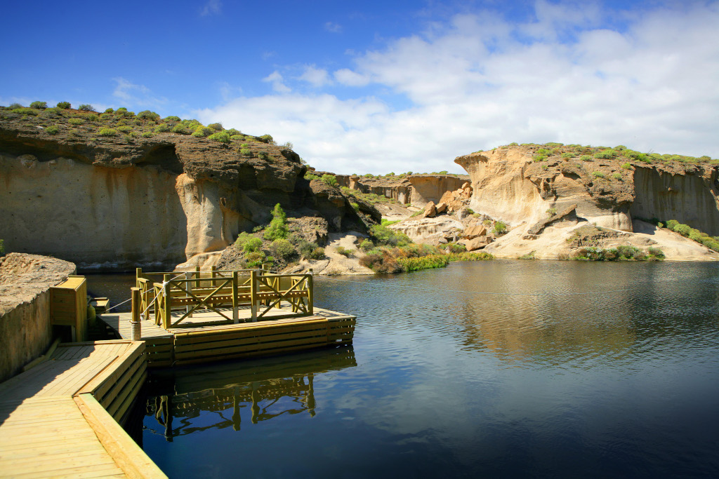 Rock formation and wooden pier in Los Barrancos, Tenerife.