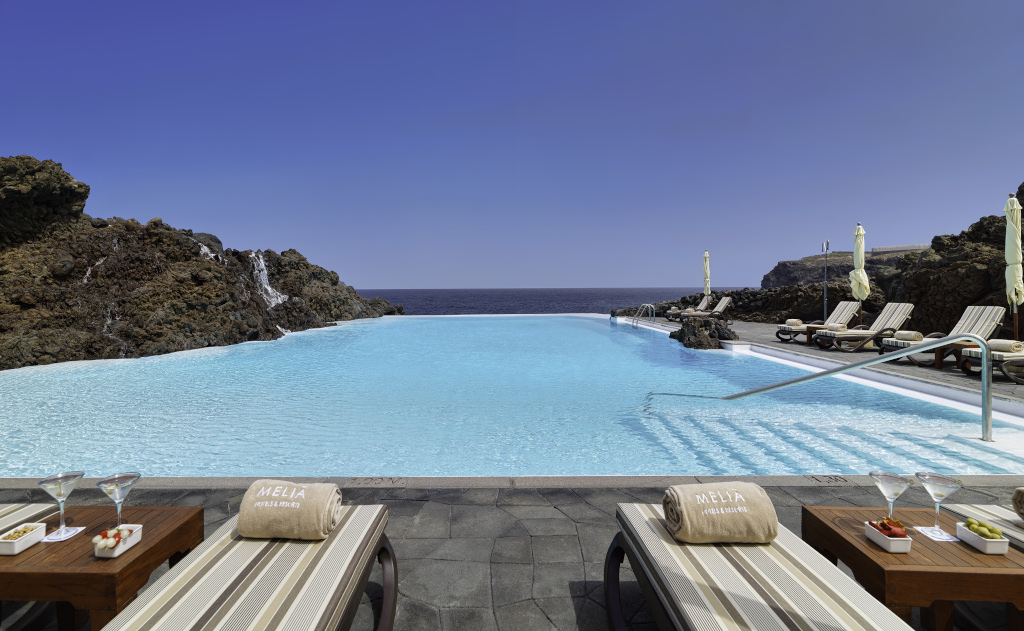 Infinity pool in a hotel in Tenerife with views of the Atlantic Ocean.