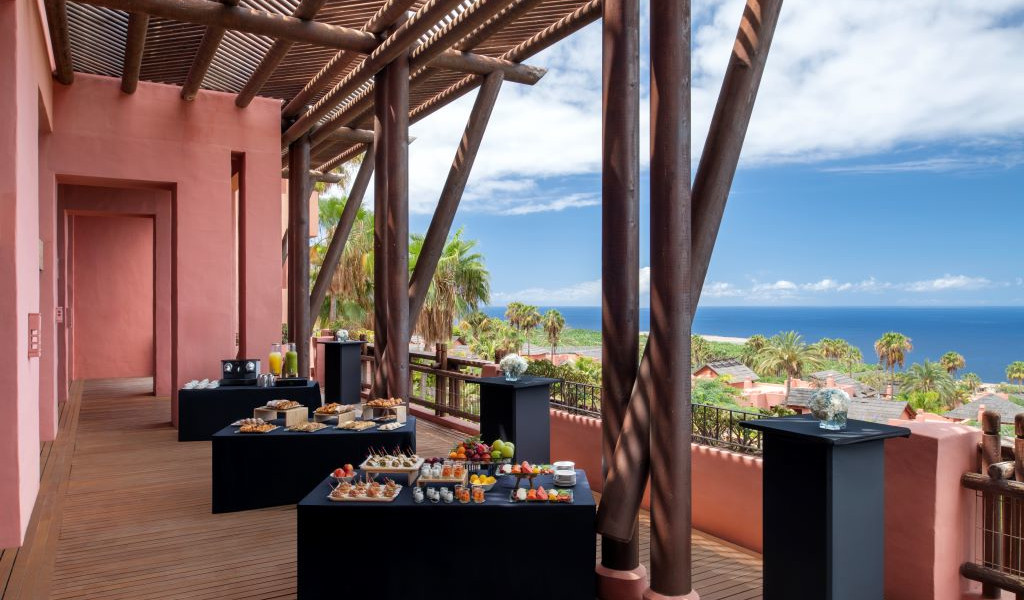 Sandwich and juice table on a terrace overlooking the sea in Tenerife.