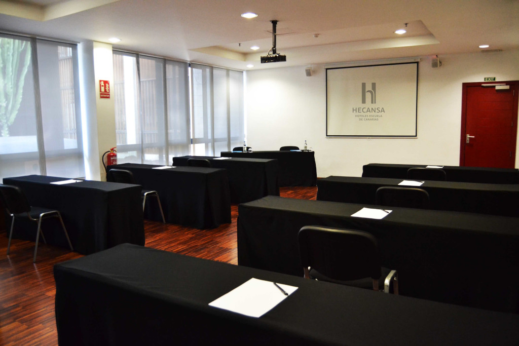 Conference room prepared with tables and chairs in Hecansa, Tenerife.