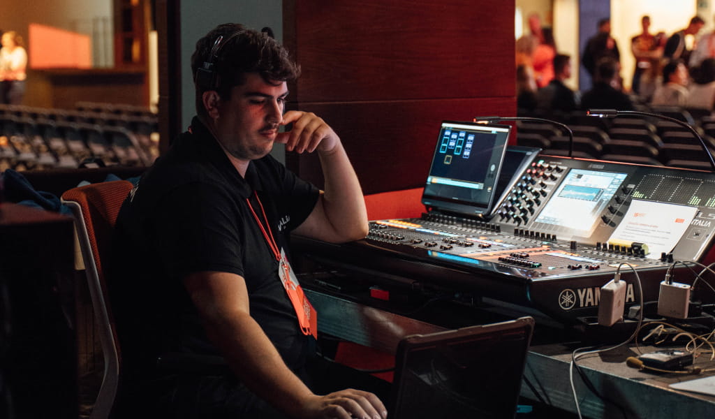 Operator at sound desk during event in Tenerife.