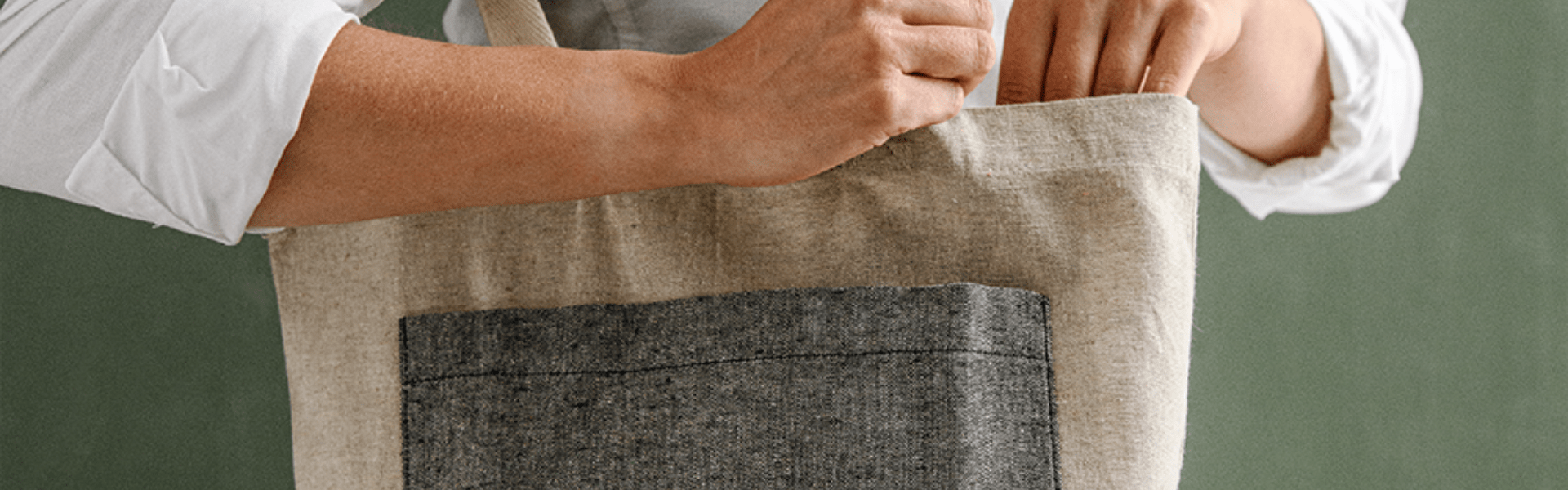 Hand Storing Object in Cloth Bag with Dark Pocket.