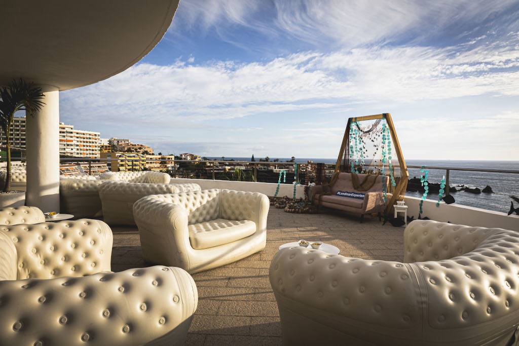 Terrace with white sofas and sea view in Tenerife.