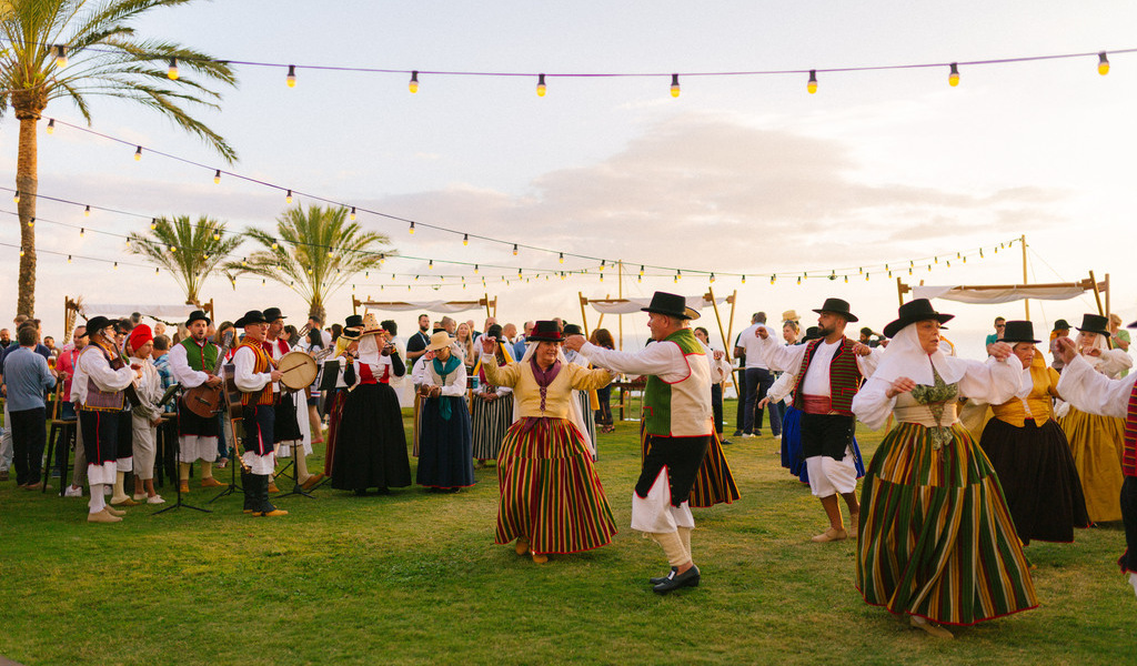People dancing in national costumes during festival in Tenerife.