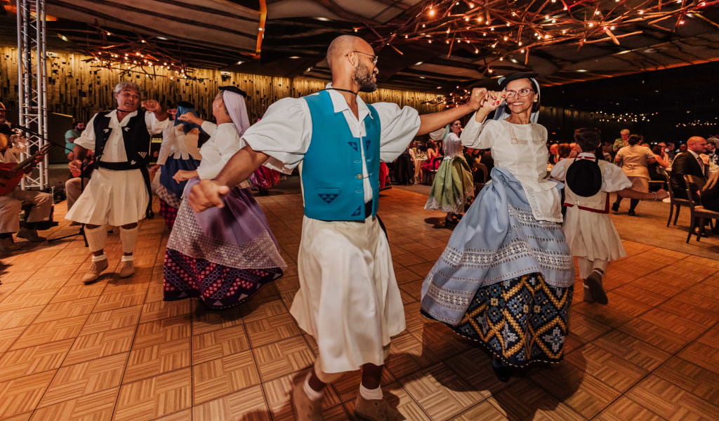 People dancing in national costumes at a cultural event in Tenerife.