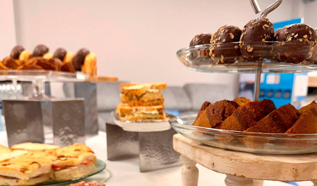 A variety of desserts and biscuits on display in a cafeteria in Tenerife.