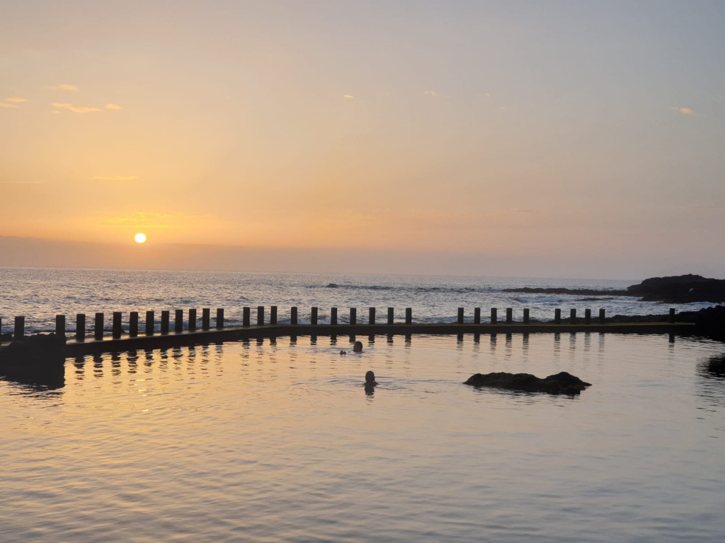 Sunset over a natural seawater pool in Tenerife.