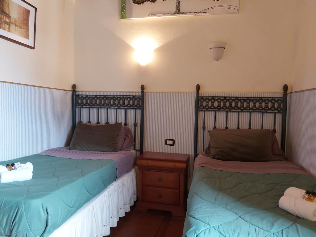 Two twin beds in a cozy room at a Tenerife accommodation.