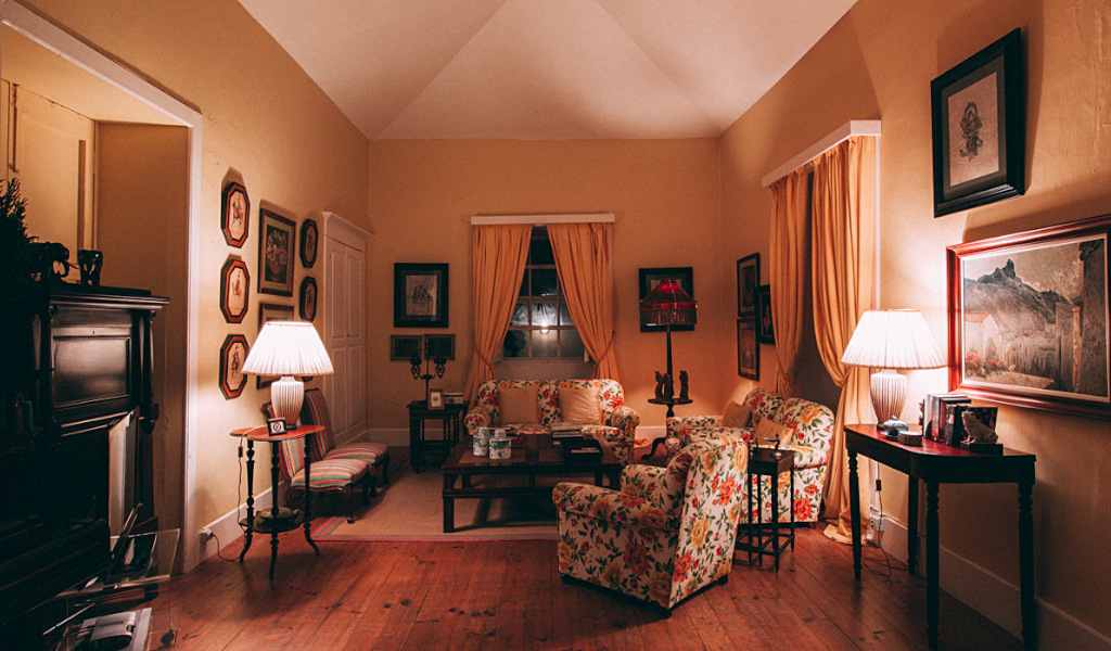 Living room with floral furniture and artwork in La Orotava, Tenerife.