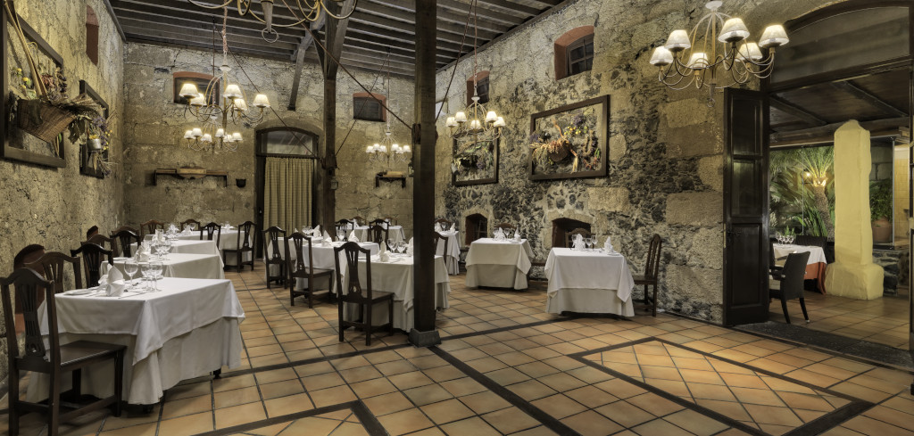 Elegant dining room with tables set for guests, located in Tenerife.