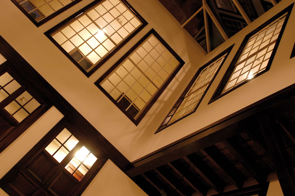 Illuminated interior windows at night in a building in Tenerife.