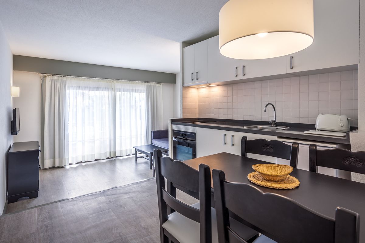Apartment kitchen and dining area with natural light in Tenerife.