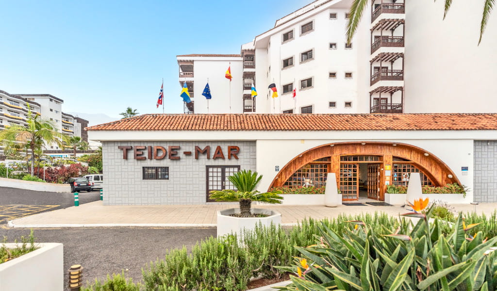 Teide-Mar entrance with flags and plants, Tenerife.