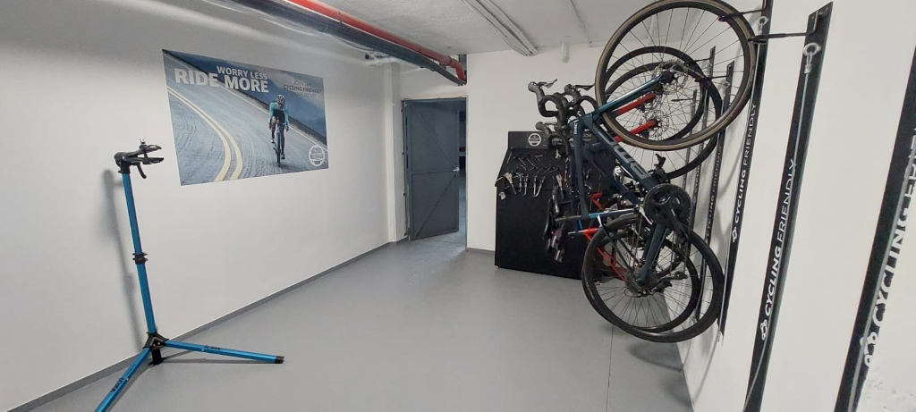 Bicycle storage room with wall-mounted racks and maintenance tools in Tenerife.