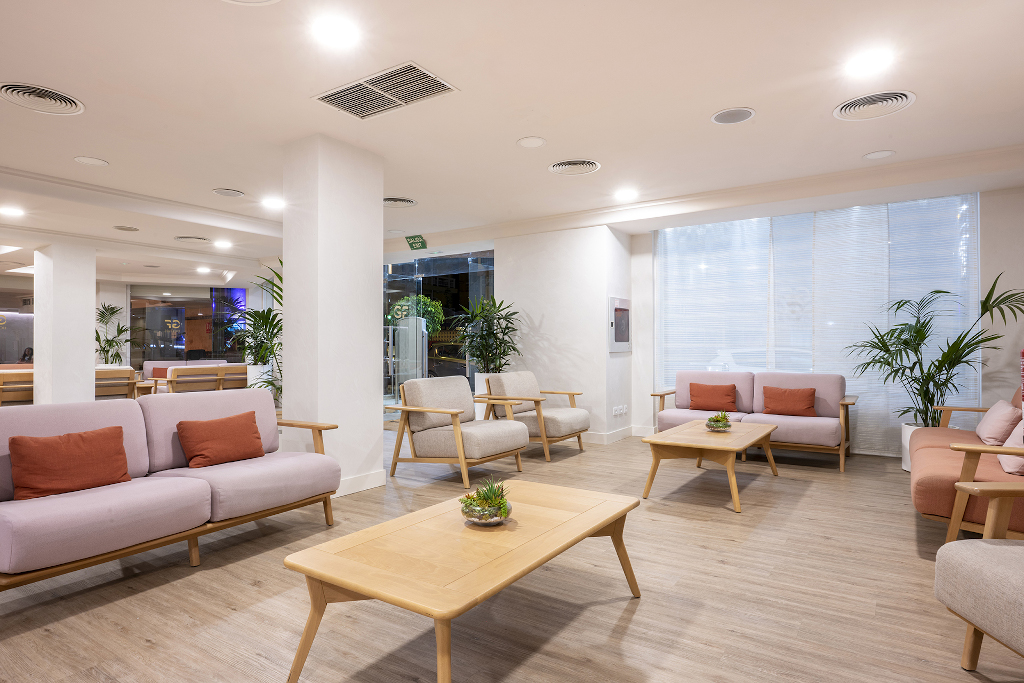 Spacious lounge area with sofas and plants in a Tenerife hotel.