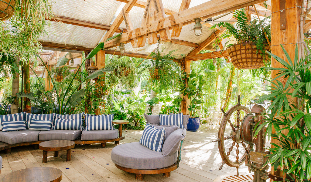 Outdoor seating area with striped cushions and plants in Tenerife.