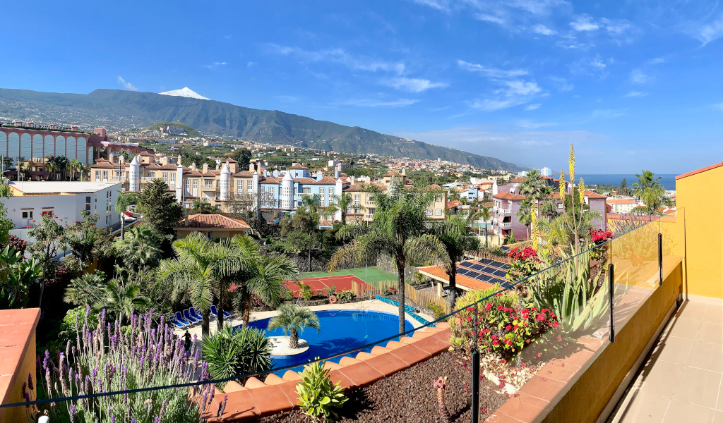 View of Puerto de la Cruz with Mount Teide and gardens in Tenerife.