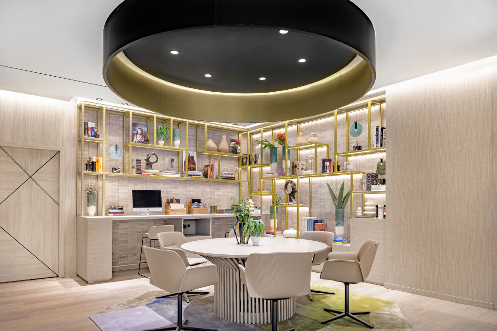 Modern office area with a round table, chairs, and a computer in Tenerife.
