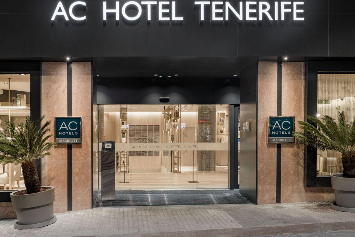 Entrance of AC Hotel Tenerife with visible signage and glass doors.