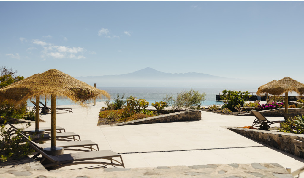 Sun loungers and parasols with ocean view in Tenerife.