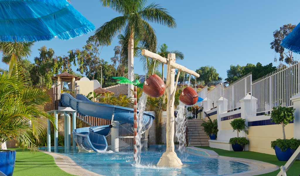 Children's water play area with slides and splash buckets, Tenerife.