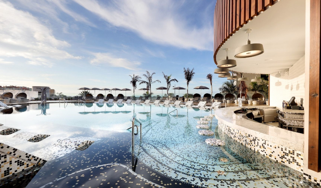 Luxurious pool with bar and ocean view in Tenerife.