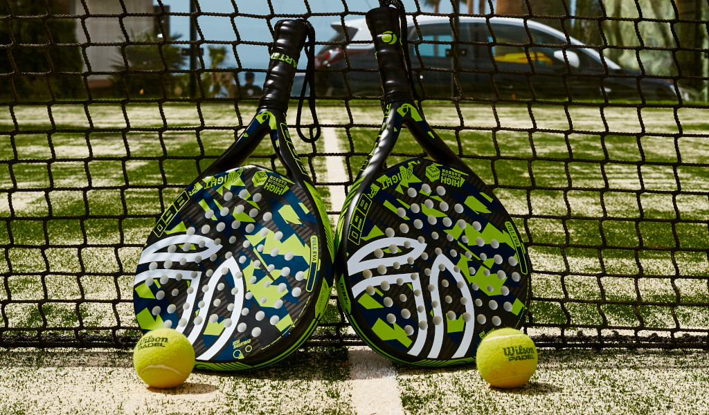 Two padel rackets and balls on a court in Tenerife.