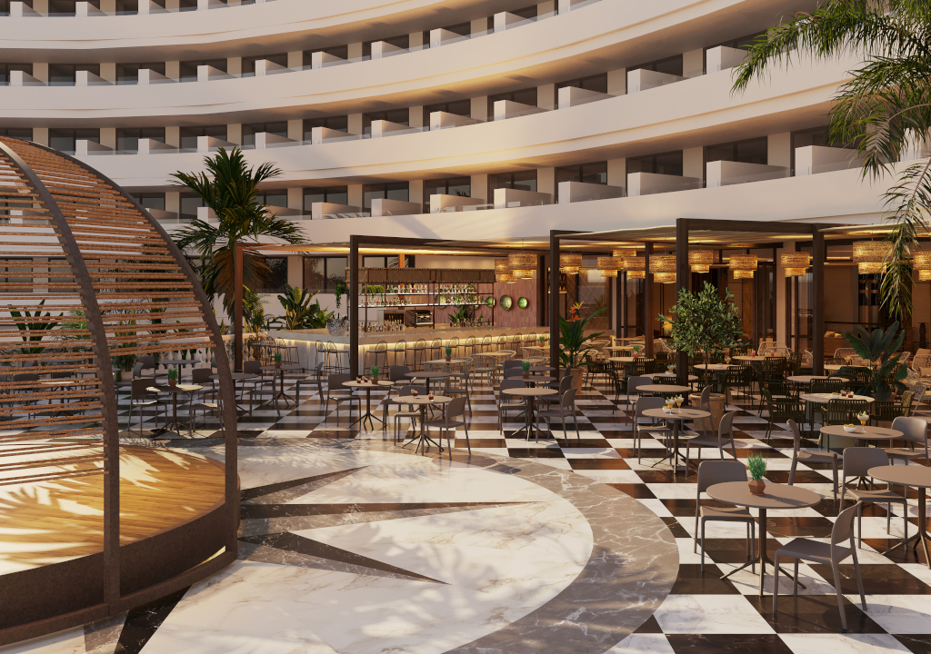 Open-air restaurant in a hotel with palm trees and seating area in Tenerife.