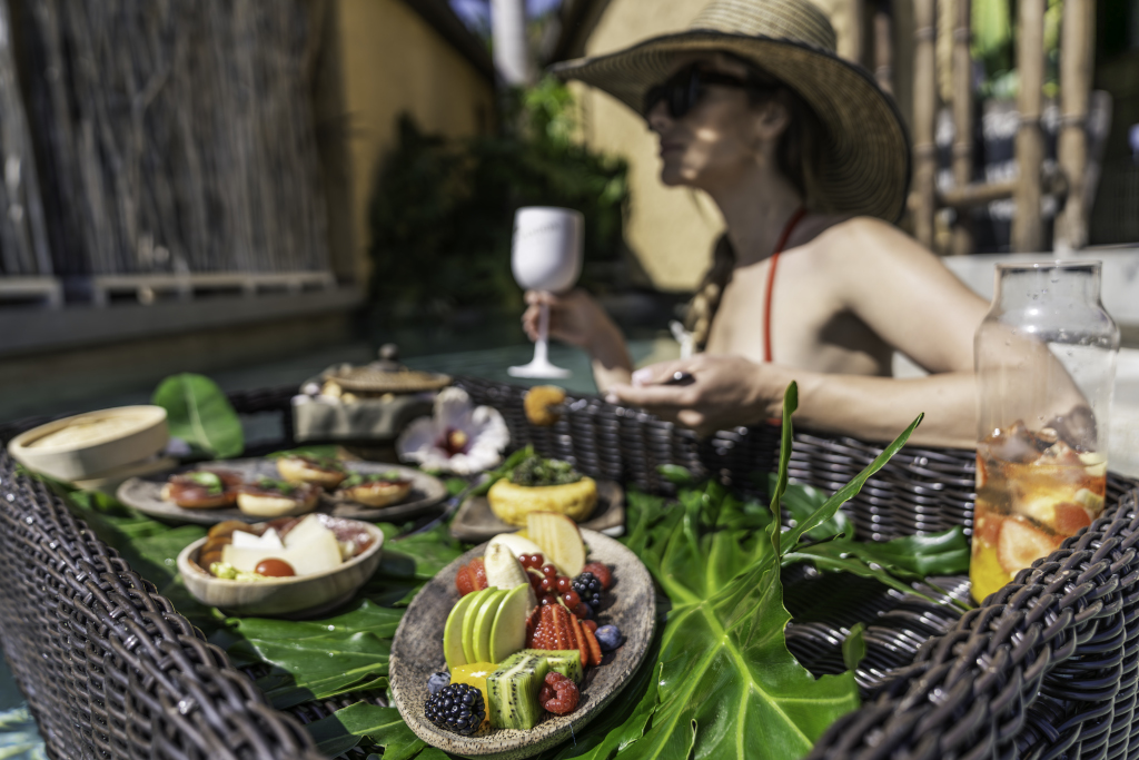 Floating brunch with fruit and drinks by the pool in Tenerife.