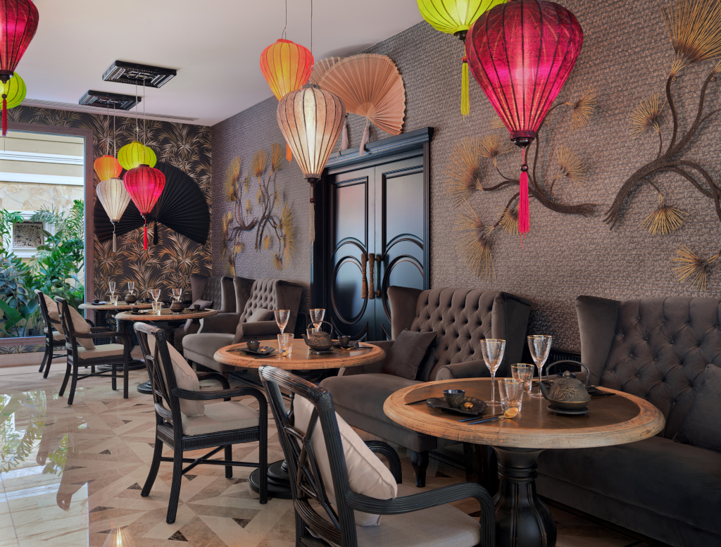 Restaurant interior with colorful lanterns and round tables in Tenerife.