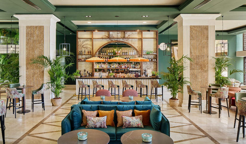 Hotel bar with seating and plants in Tenerife.