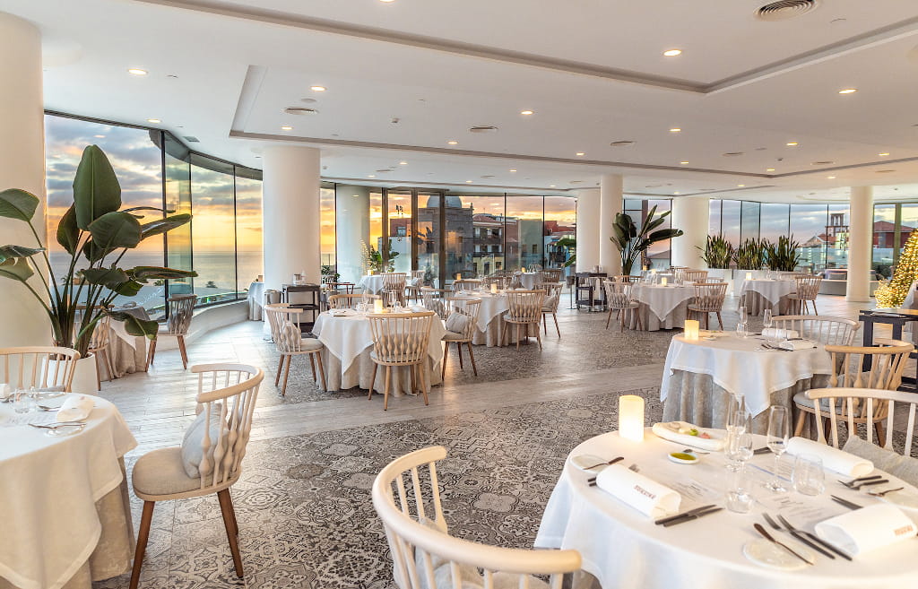 Modern restaurant with sea view at sunset in Tenerife.