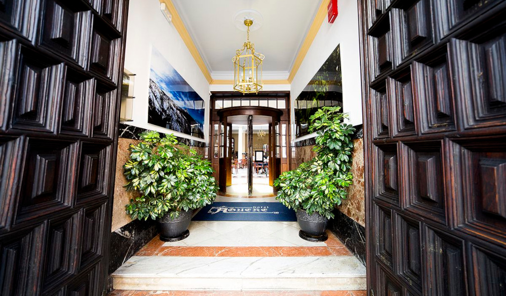 Entrance with plants and a sign reading Hotel Marte in Tenerife.