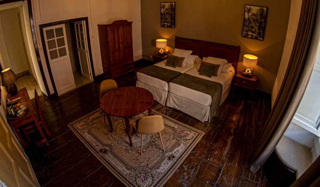 Two twin beds in a hotel room with wooden furniture in Tenerife.