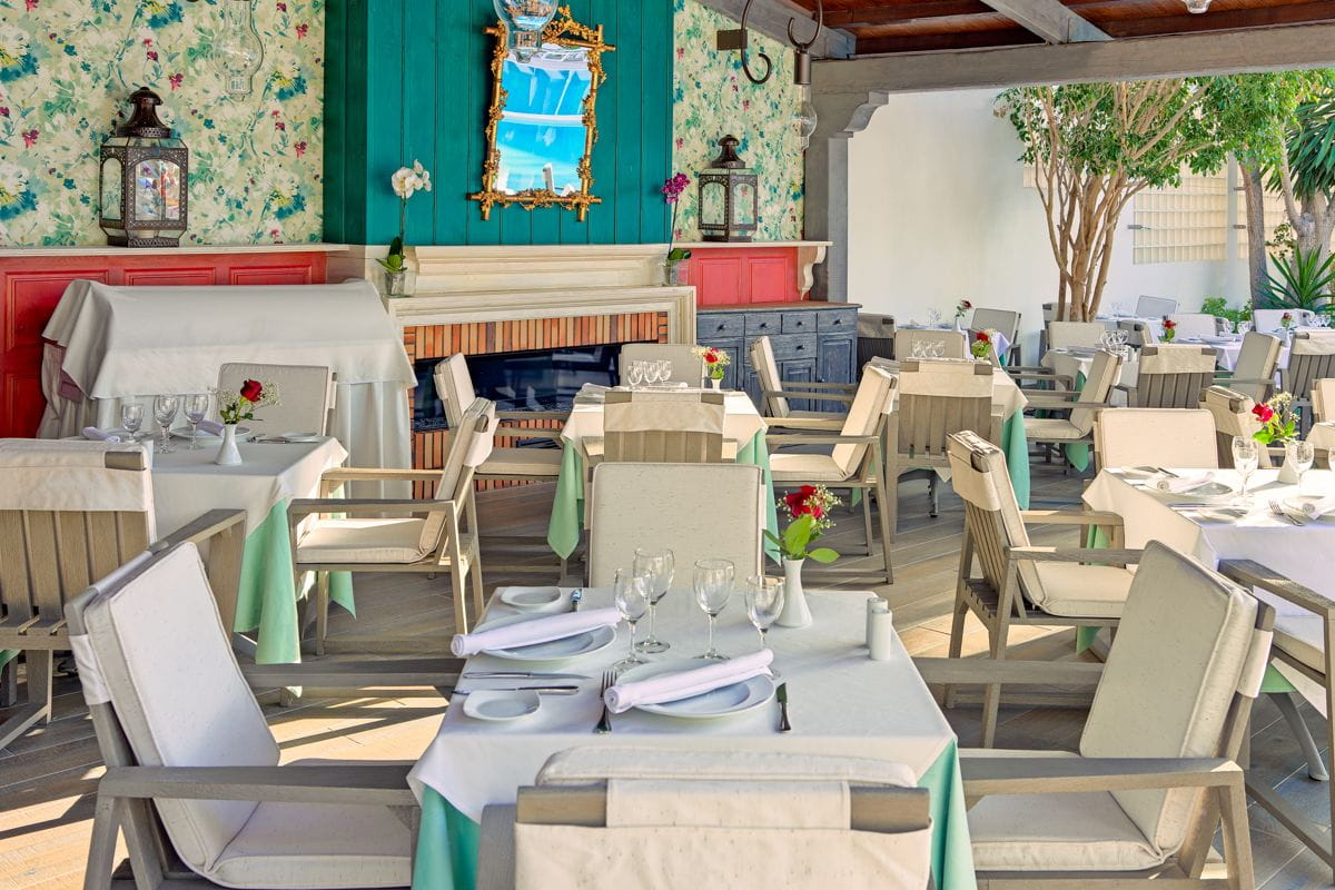 Outdoor dining area with set tables and chairs in Puerto de la Cruz, Tenerife.