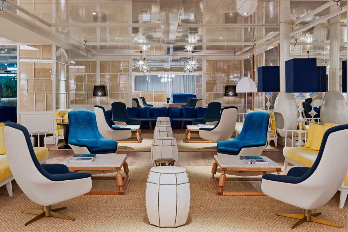 Seating area with blue and yellow chairs in Tenerife lounge.
