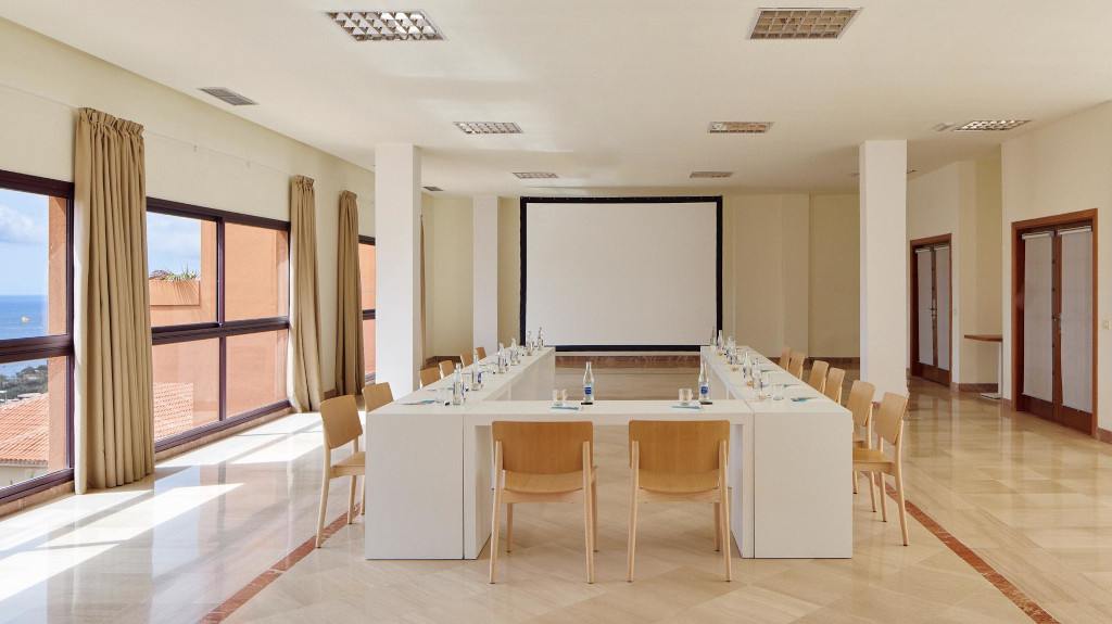 Meeting room with U-shaped table setup and ocean view in Tenerife.