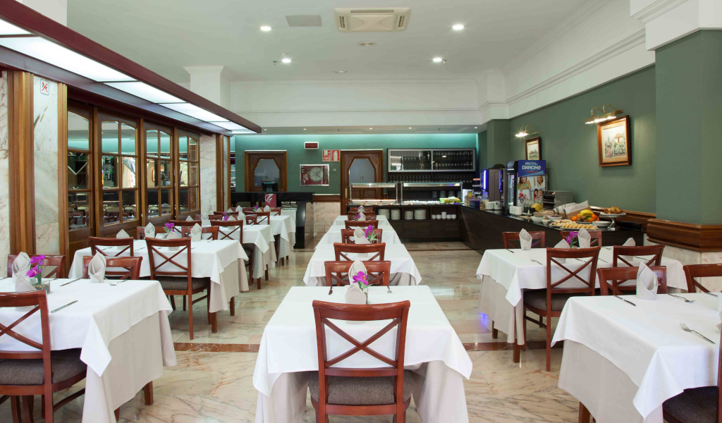 Dining area with set tables and buffet in a Tenerife restaurant.