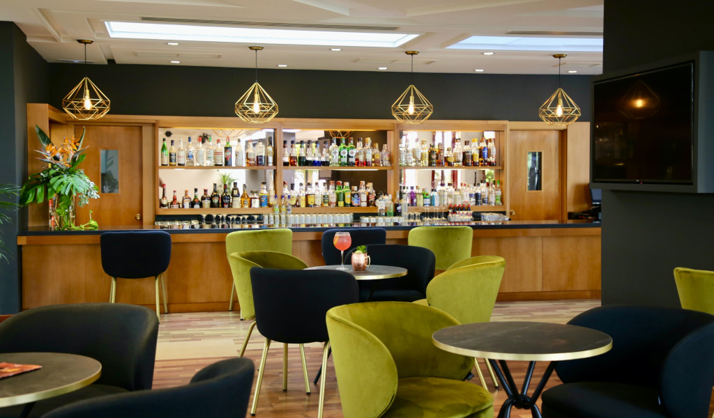 Bar with various bottles and seating area in Tenerife.