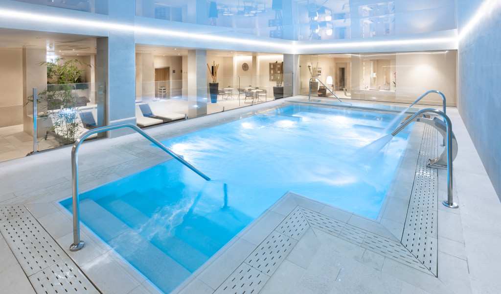 Indoor swimming pool with lounge chairs in a Tenerife hotel.