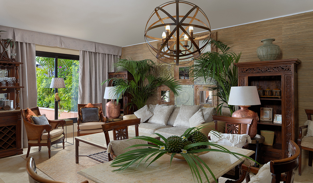 Elegant living room with wooden furniture and plants in Tenerife.