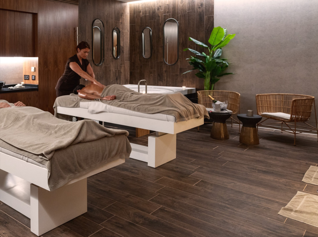 Massage therapist giving a body massage in a spa room in Tenerife.
