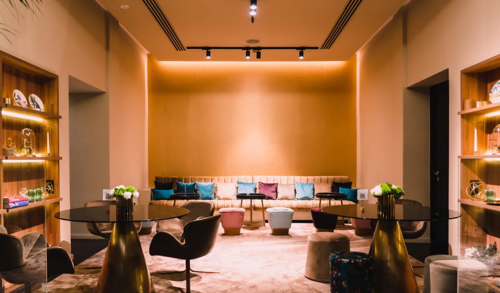 Modern lounge with chairs, tables, colorful pillows in a hotel in Tenerife.