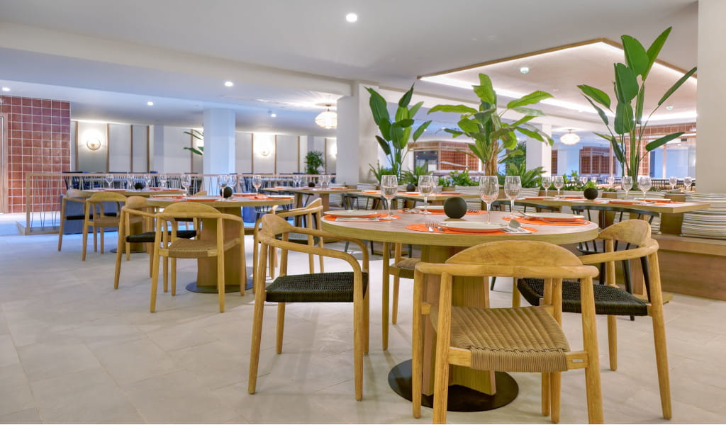 Restaurant dining area with wooden tables set for guests in Tenerife.