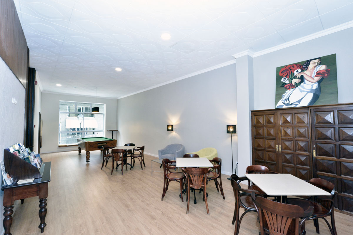 Game room with tables, chairs, and a pool table in northern Tenerife.