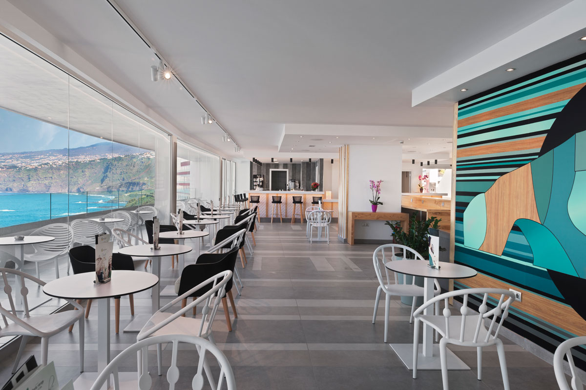 Modern café interior with ocean view in Tenerife.